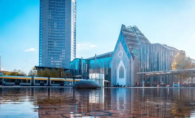 blue and white concrete building near body of water during daytime